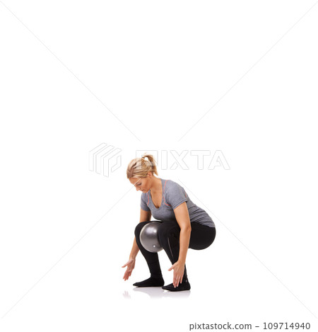 Exercise knee, squat and woman on ball in workout, training and healthy body isolated on a white studio background mockup space. Legs, balance or person on equipment for pilates, fitness or wellness 109714940
