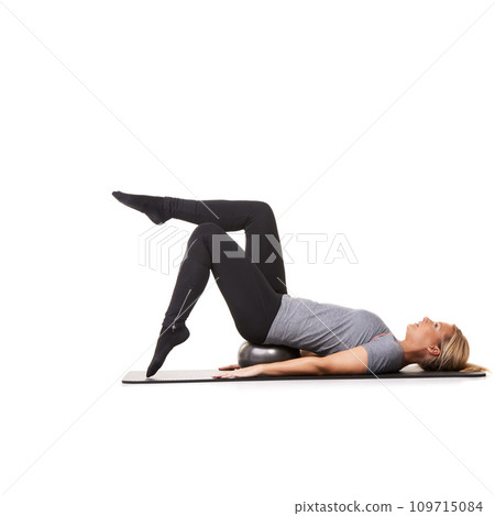 Workout legs, pilates and woman on ball in exercise, training and healthy body isolated on a white studio background mockup space. Floor, mat and person on equipment for sports, balance or fitness 109715084