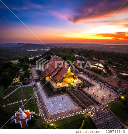 Aerial view of Wat Sirindhorn Wararam glowing temple in Ubon, Thailand 109715143