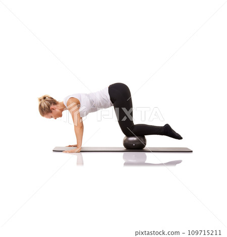 Fitness, pilates and woman on floor with ball for exercise, body building care and health in studio. Gym, training and girl on mat with cardio, energy and muscle workout isolated on white background 109715211