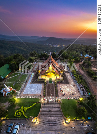 Aerial view of Wat Sirindhorn Wararam glowing temple in Ubon, Thailand Aerial view of Wat Sirindhorn Wararam glowing temple in Ubon, Thailand 109715221