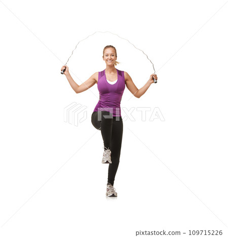Portrait, skipping rope and woman on a white background for exercise, cardio workout and training. Sports, fitness and isolated person with gym equipment for health, wellness and jumping in studio Portrait, skipping rope and woman on a white background for exercise, cardio workout and training. Sports, fitness and isolated person with gym equipment for health, wellness and jumping in studio 109715226