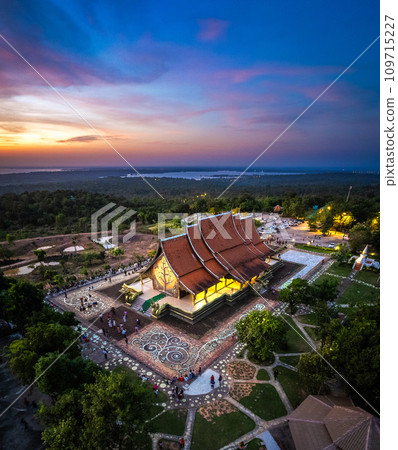 Aerial view of Wat Sirindhorn Wararam glowing temple in Ubon, Thailand 109715227
