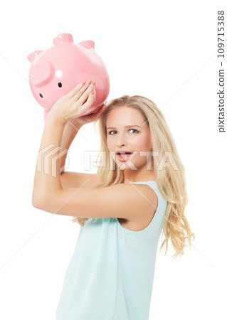 Woman, piggy bank and finance or surprised in studio with cash investment, financial growth or wealth. Person, money box and budget or banking for increase or income on white background with smile Woman, piggy bank and finance or surprised in studio with cash investment, financial growth or wealth. Person, money box and budget or banking for increase or income on white background with smile 109715388