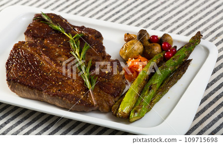 Fried steak entrecote of beef with mushroom and asparagus 109715698