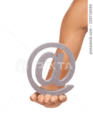 Hands, @ sign and closeup on a white background in studio isolated on mockup or copy space. Fingers, palm and at symbol, font and letter, character and icon for address, social media and alphabet Hands, @ sign and closeup on a white background in studio isolated on mockup or copy space. Fingers, palm and at symbol, font and letter, character and icon for address, social media and alphabet 109716084