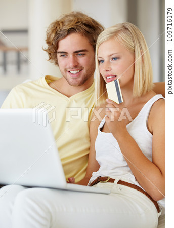 Couple, credit card and thinking on laptop for online shopping, loan choice or digital money on sofa at home. Young woman and man on computer for internet banking, website payment or e commerce ideas Couple, credit card and thinking on laptop for online shopping, loan choice or digital money on sofa at home. Young woman and man on computer for internet banking, website payment or e commerce ideas 109716179
