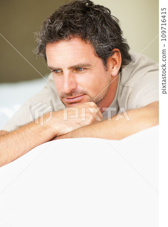 Thinking, relax and mature man in bed in the morning after nap, break or comfortable sleep at home. Smile, idea and male person from Canada wake up in bedroom for rest on cozy day in apartment. 109716415