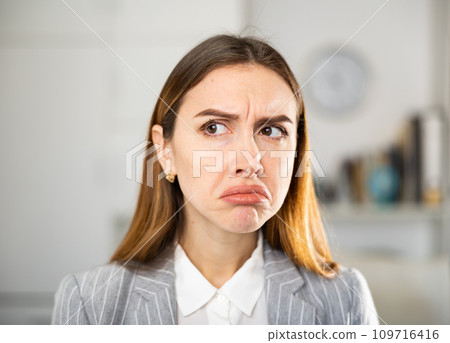 Portrait of unhappy frustrated business lady 109716416