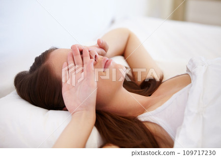 Wake up, fatigue and tired woman in bed with hands on eyes frustrated with insomnia, crisis or disaster. Bedroom, problem or female person in house with sleeping issue, struggle or low energy at home 109717230