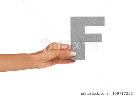 Hands, capital letter and F in studio for alphabet, font sign or learning english language on white background. Closeup, woman or text design, typography or character of grammar, teaching or spelling Hands, capital letter and F in studio for alphabet, font sign or learning english language on white background. Closeup, woman or text design, typography or character of grammar, teaching or spelling 109717298