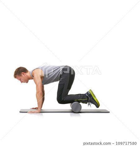 Exercise, foam roller and man in floor push up for arm strength building, muscle growth or bodybuilding workout. Balance, mockup studio space or sports person in pilates training on white background 109717580