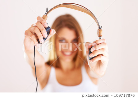 Hands, portrait and happy woman with headphones in studio for listening, invitation or deal on white background. Music, offer and face of female model with subscription, streaming or radio earphones Hands, portrait and happy woman with headphones in studio for listening, invitation or deal on white background. Music, offer and face of female model with subscription, streaming or radio earphones 109717876