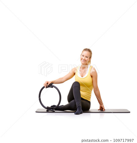 Pilates ring, fitness and portrait of woman in studio isolated on a white background mockup space. Smile, person on mat and magic circle for training, exercise sport and healthy body workout on floor Pilates ring, fitness and portrait of woman in studio isolated on a white background mockup space. Smile, person on mat and magic circle for training, exercise sport and healthy body workout on floor 109717997