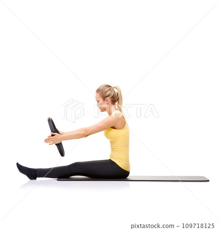 Woman, pilates ring and arms for stretching exercise on yoga mat or resistance healthy, roll up or studio white background. Female person, equipment for muscle flexibility, wellness balance or mockup Woman, pilates ring and arms for stretching exercise on yoga mat or resistance healthy, roll up or studio white background. Female person, equipment for muscle flexibility, wellness balance or mockup 109718125