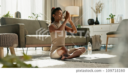Woman, yoga and namaste on floor, peace or home for chakra balance, relax or breathing in living room. Girl, meditation and spiritual with zen, pilates or workout for wellness, fitness or mindfulness Woman, yoga and namaste on floor, peace or home for chakra balance, relax or breathing in living room. Girl, meditation and spiritual with zen, pilates or workout for wellness, fitness or mindfulness 109718160