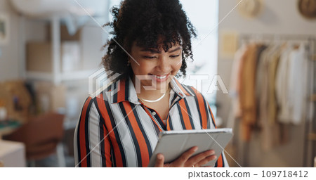 Businesswoman, happy and smile with tablet in office for customer review, feedback or success of delivery. African person, fashion designer and excited for growth in sales, retail and e commerce Businesswoman, happy and smile with tablet in office for customer review, feedback or success of delivery. African person, fashion designer and excited for growth in sales, retail and e commerce 109718412