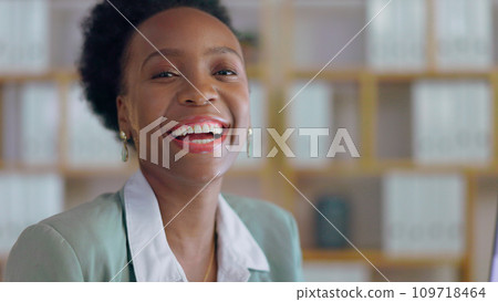 Portrait, laughing and business black woman manager in an office at night for corporate or professional work. Face, management and funny with a happy young CEO or boss in a suit at the workplace 109718464