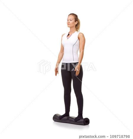 Woman, exercise and mat in studio for fitness, pilates or workout for healthy body, wellness or balance. Person, face and yoga in sportswear for physical activity on mock up space or white background 109718798