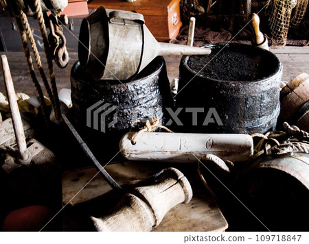 Interior, cabin and vintage tools, equipment and relics, barrels and bellows for storage of gear. Retro room, rustic cottage and old rope, wood and hammer in house, home and architecture in shack 109718847