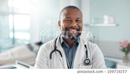 Healthcare, doctor and black man with arms crossed at hospital with smile for support, service and wellness. Medicine, professional and African expert with happiness and pride for career or surgery 109719257
