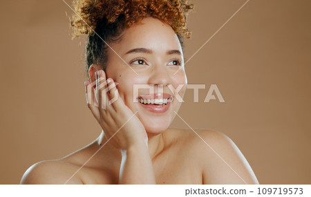Woman, hand on face with natural beauty and happy with cosmetics and skin glow isolated on brown background. Dermatology, wellness and skincare, model smile for self care and anti aging in studio 109719573