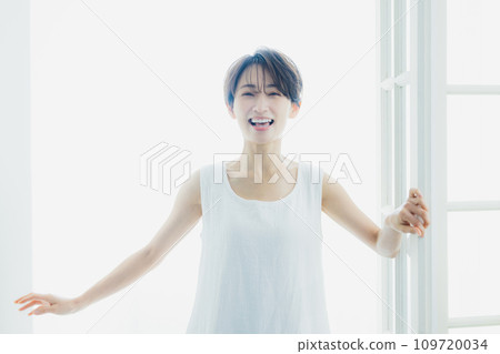 A woman by the window 109720034