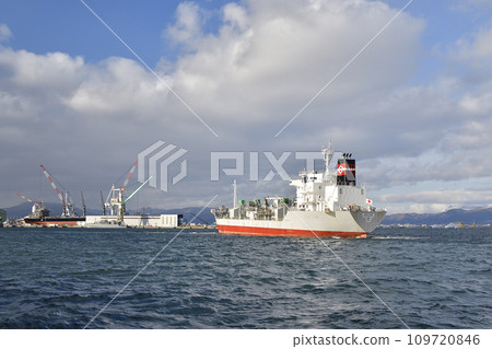 Photographing the scenery of a cargo ship leaving Hakodate Port in Hakodate City, Hokkaido in winter 109720846