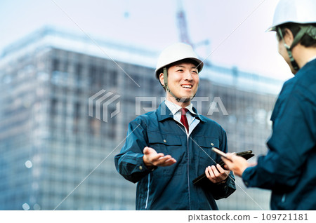 Workers talking 109721181