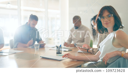 Meeting, smile and portrait of businesswoman in office for working on a creative project in collaboration. Teamwork, happy and face of female designer with colleagues for plan in workplace. 109723628