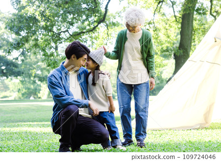3 generation family enjoying camping 3 generation family enjoying camping 109724046