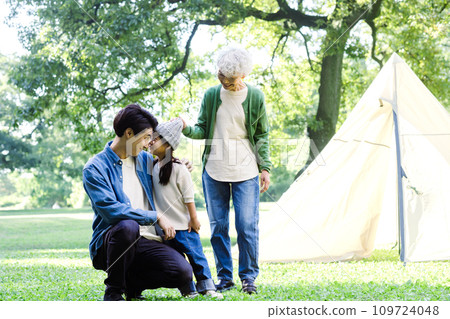 3 generation family enjoying camping 3 generation family enjoying camping 109724048