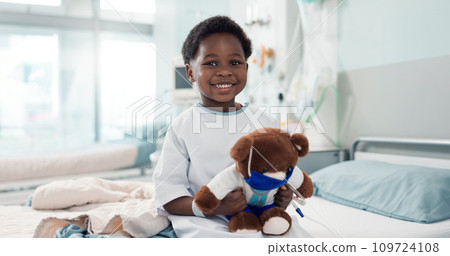 Healthcare, black child and teddy bear in hospital for surgery recovery, patient and healthy results. Face, boy kid and bed for medical, wellness or toy for relax on bed, rehabilitation and happiness 109724108