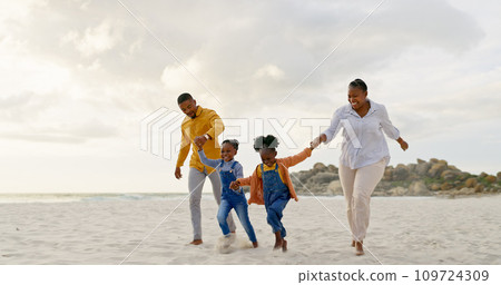 Happy, travel and holding hands with black family at beach for summer, vacation and relax. Holiday, support and love with parents and children walking on coastline for care, trust and freedom 109724309