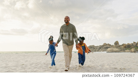 Walking, father and children holding hands at the beach for bonding, summer freedom and care. Happy, family and an African dad with affection for kids on a walk in the sand at the ocean on holiday 109724367