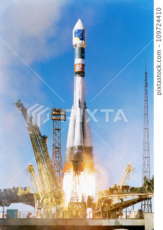 Rocket launch into sky, travel and space mission for research, exploration and discovery in cosmos. Science, aerospace innovation or technology, spaceship in flight at ground site with flame and fuel 109724410