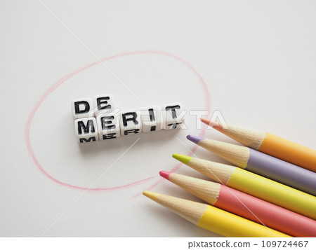 Disadvantages text and colored pencils, white background, copy space Disadvantages text and colored pencils, white background, copy space 109724467