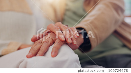Hands, support and a senior couple closeup in their home for love, sympathy or trust during retirement. Hope, healing and empathy with elderly people on a sofa in the living room of their home 109724478