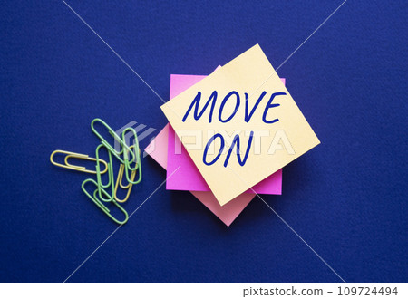 Move on symbol. Orange steaky note with words Move on. Beautiful deep blue background. Business and Move on concept. Copy space. Move on symbol. Orange steaky note with words Move on. Beautiful deep blue background. Business and Move on concept. Copy space. 109724494