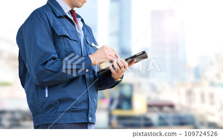 Man with tablet and work clothes Man with tablet and work clothes 109724526