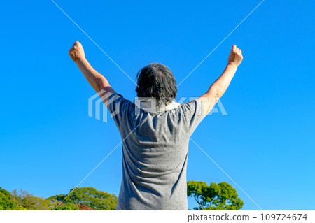 Senior woman walking against the blue sky, fresh green park, diet, exercise, healthy habits, walk trimmed up Senior woman walking against the blue sky, fresh green park, diet, exercise, healthy habits, walk trimmed up 109724674