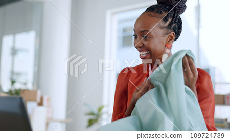 Fashion designer, material and black woman on video call on laptop with fabric, pattern and texture. Communication, client and person on computer for creative startup, small business and boutique 109724789