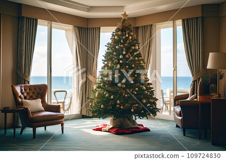 A Christmas tree is decorated on the hotel by the sea view on vacation in a tropical country with palm trees at sunset. Travel for Christmas and New Year, tour to the resort A Christmas tree is decorated on the hotel by the sea view on vacation in a tropical country with palm trees at sunset. Travel for Christmas and New Year, tour to the resort 109724830