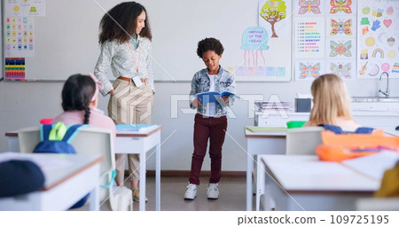 School, child and reading a book in class for learning, development and communication. A african boy kid or student and teacher woman for language, support and assessment in elementary classroom 109725195