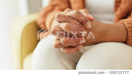 Hands, stress and senior woman on a sofa with anxiety, fear or grief, dementia or scared in her home. Stress, worry and nervous elderly female in a living room with Alzheimer, arthritis or depression 109725777