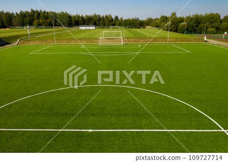 Top view of a football field with green grass outdoors in summer 109727714