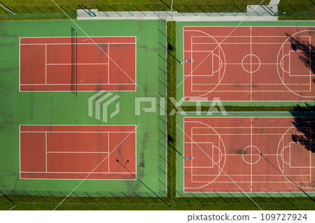 View from the height of the empty Tennis courts in the daytime in summer 109727924