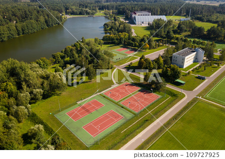 View from the height of the empty Tennis courts in the daytime in summer View from the height of the empty Tennis courts in the daytime in summer 109727925