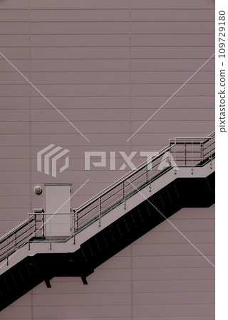 Emergency stairs on the outside wall of the building 109729180