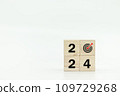 Wooden cubes with 2024 and goal icon on white background. 109729268